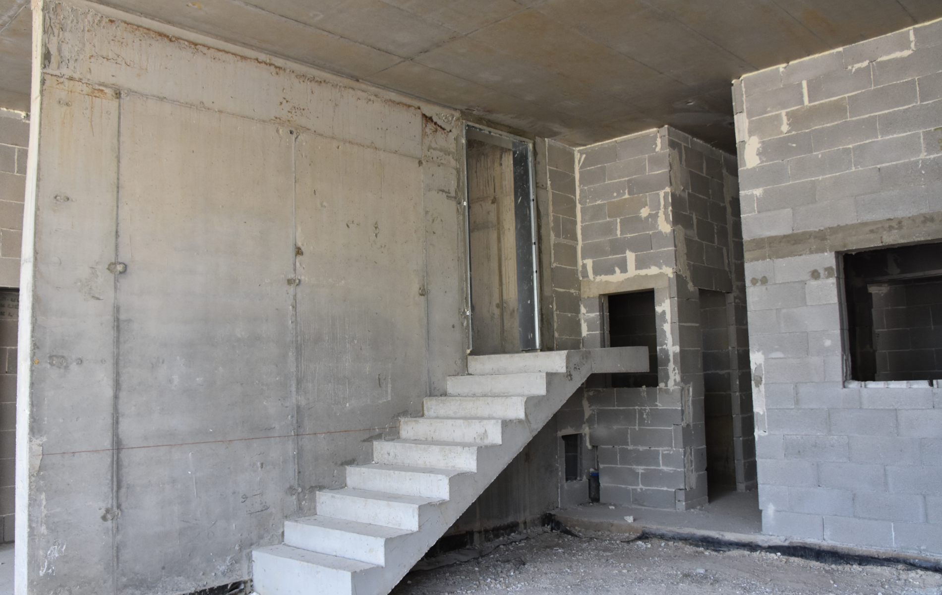 A concrete staircase in a building under construction