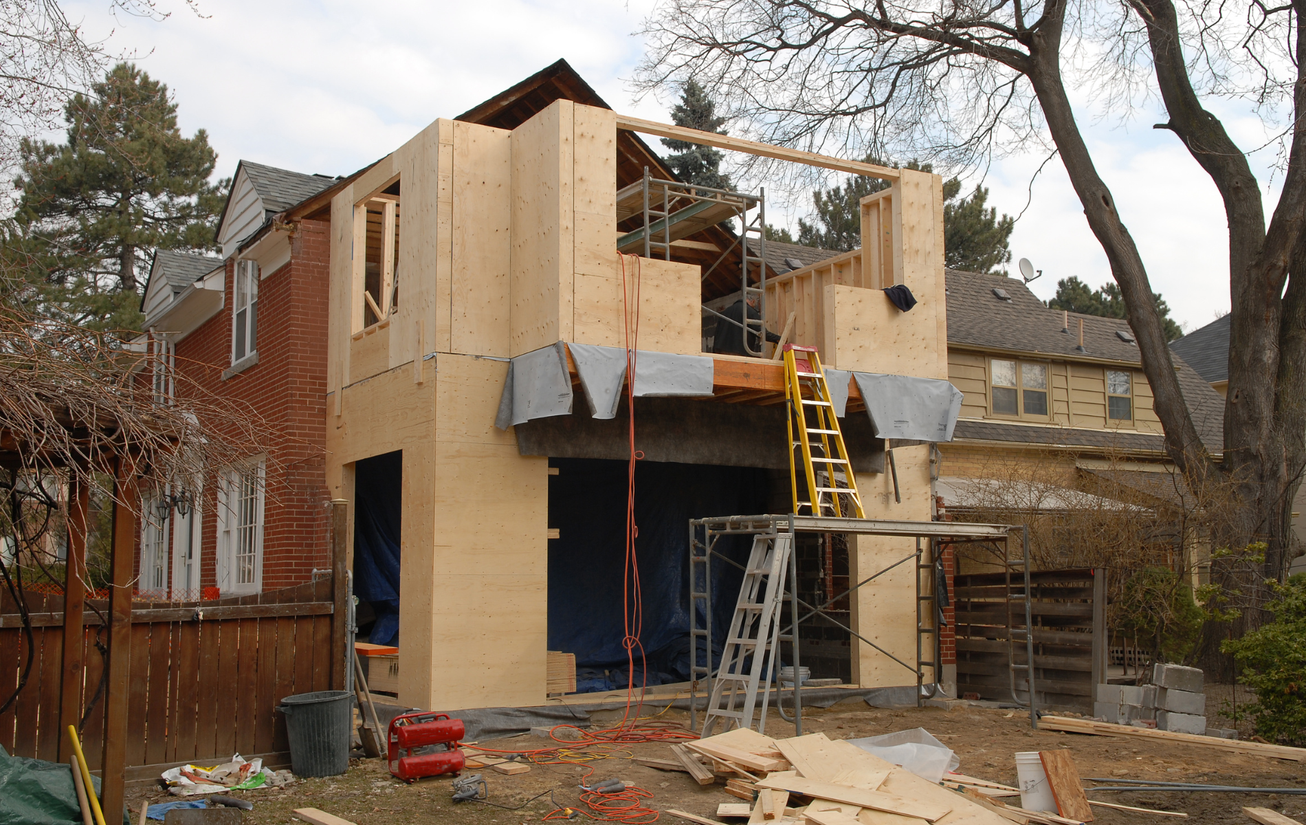 A house that is being built with a ladder in front of it