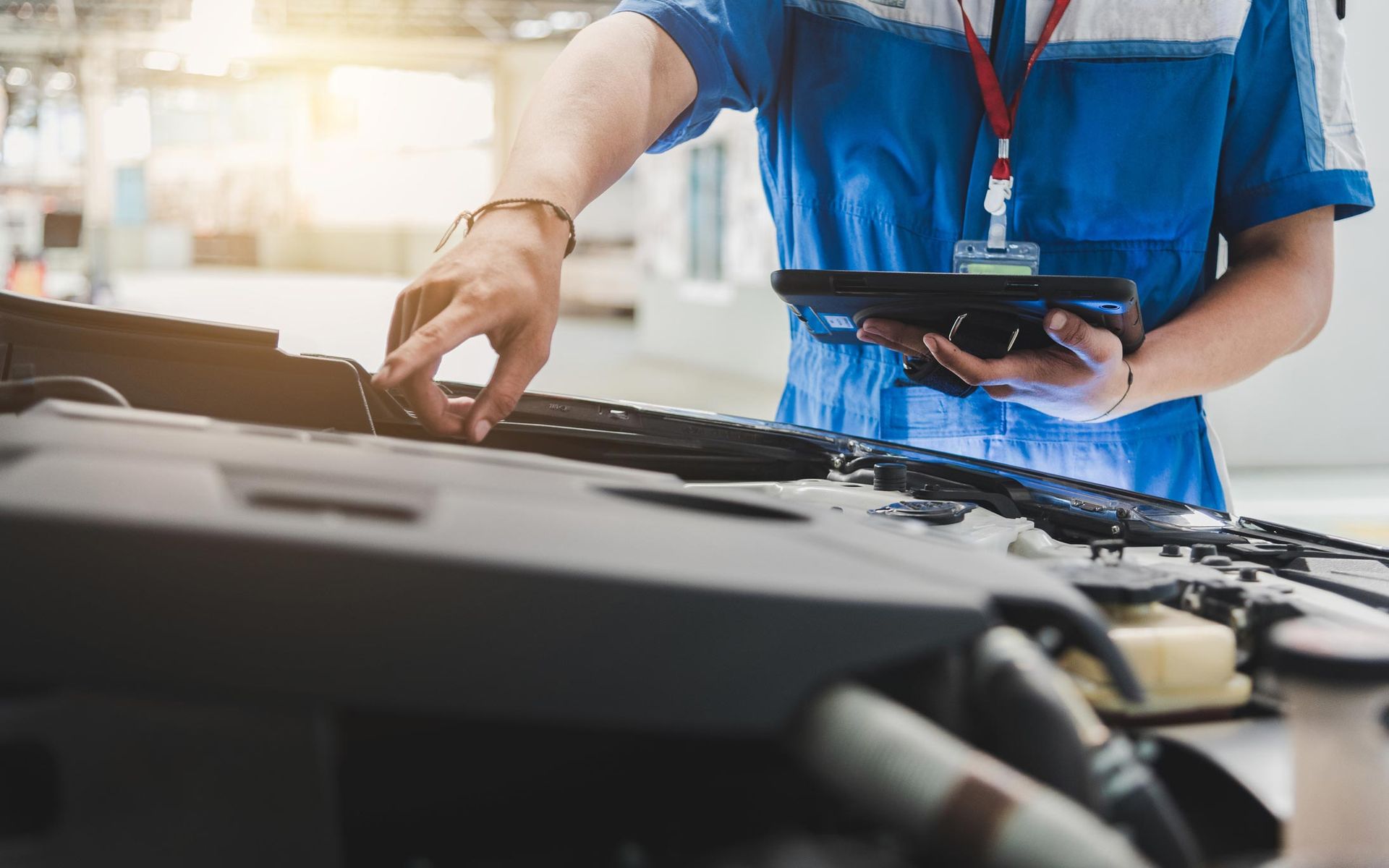 Auto Mechanic Uses The Tablet To Check — Justin, TX — Auto Revival