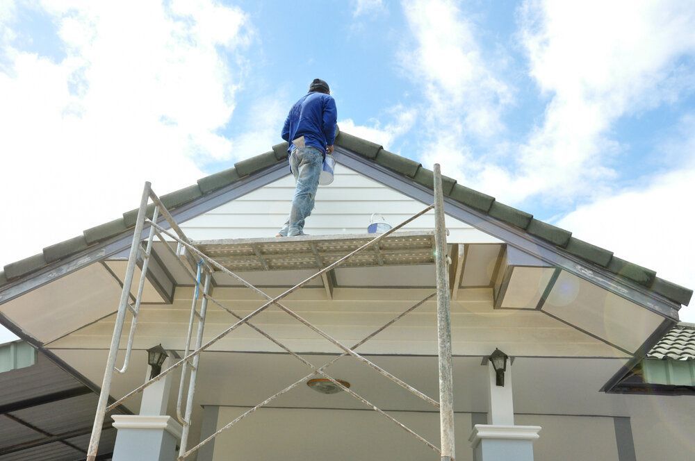 Exterior Painting. Scaffolding set up outside the home is ready to paint.