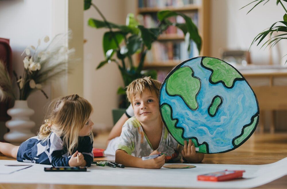 Eco-Friendly Painting Solutions. Children lying on floor.