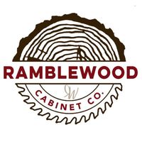 Logo for Ramblewood Cabinet Co., featuring a wood slice and a saw blade around text.