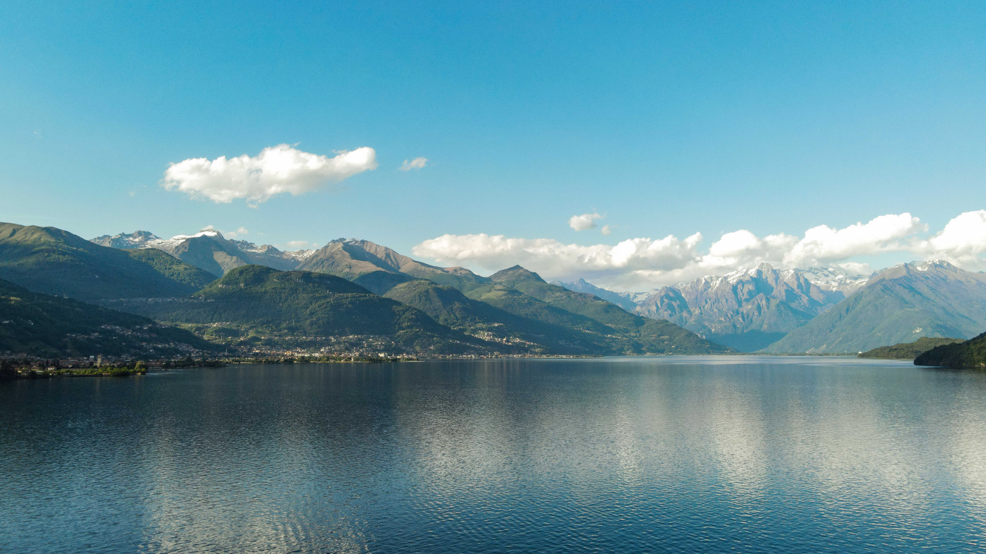 Large lake in front of a tall mountain in The Olympic Mountains of Washington state in the USA.