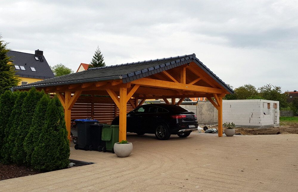 A Car Is Parked Under A Wooden Carport — CBY Carpentry & Renovations In Dubbo, NSW