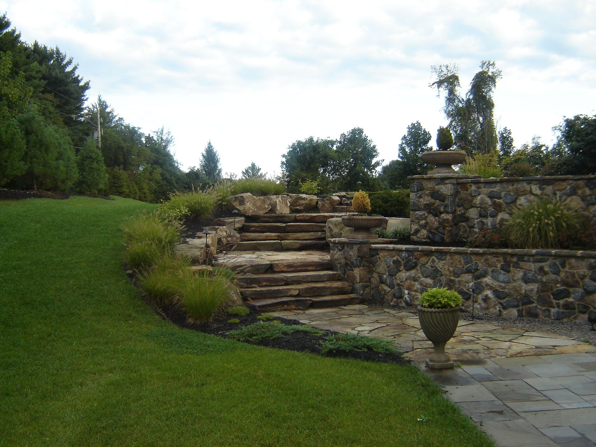 A Stone Stairs Leading to a Stone Wall — Kennett Square, PA — Classic Lawns