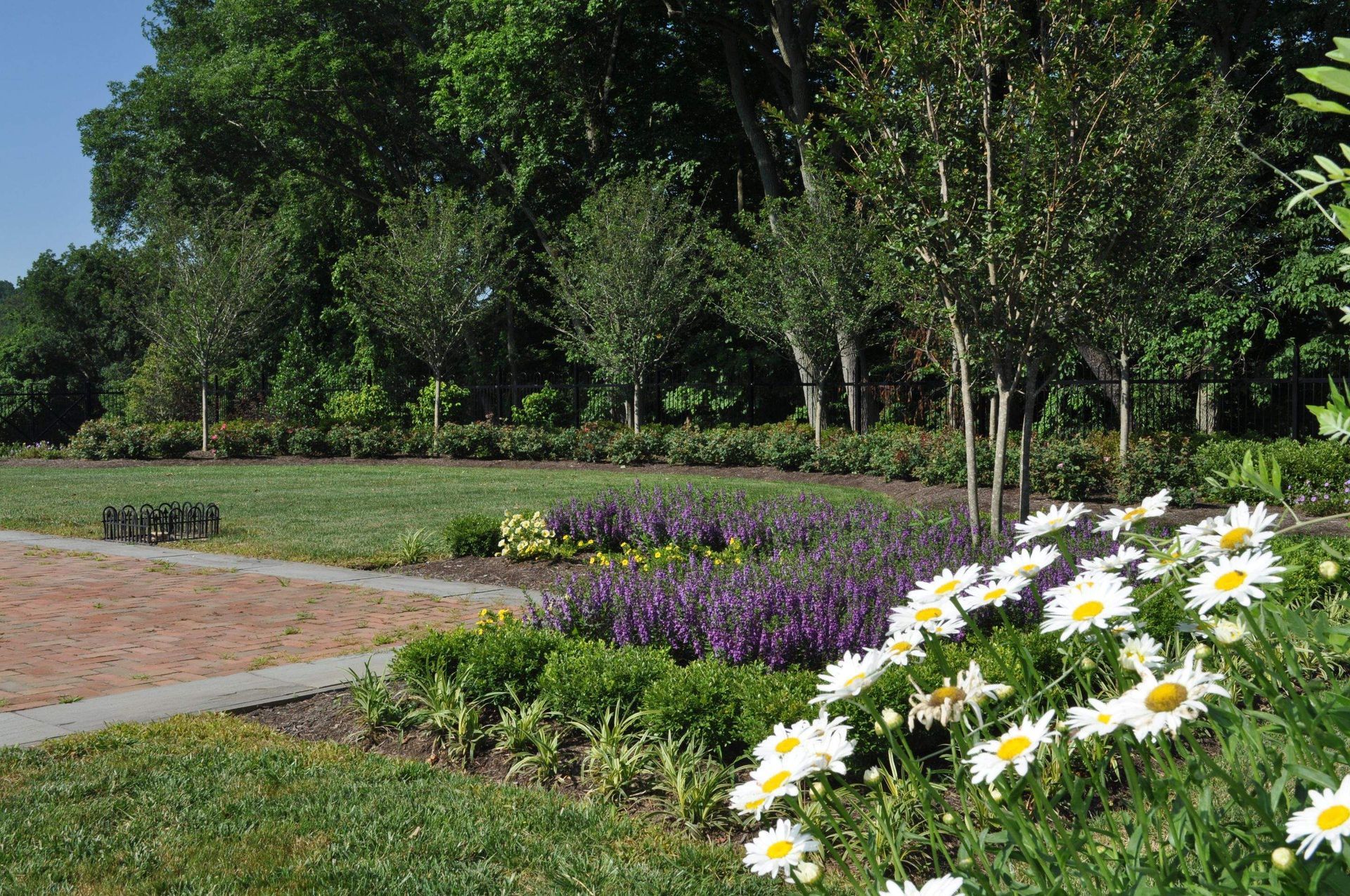 A Garden with Flowers and Trees — Kennett Square, PA — Classic Lawns