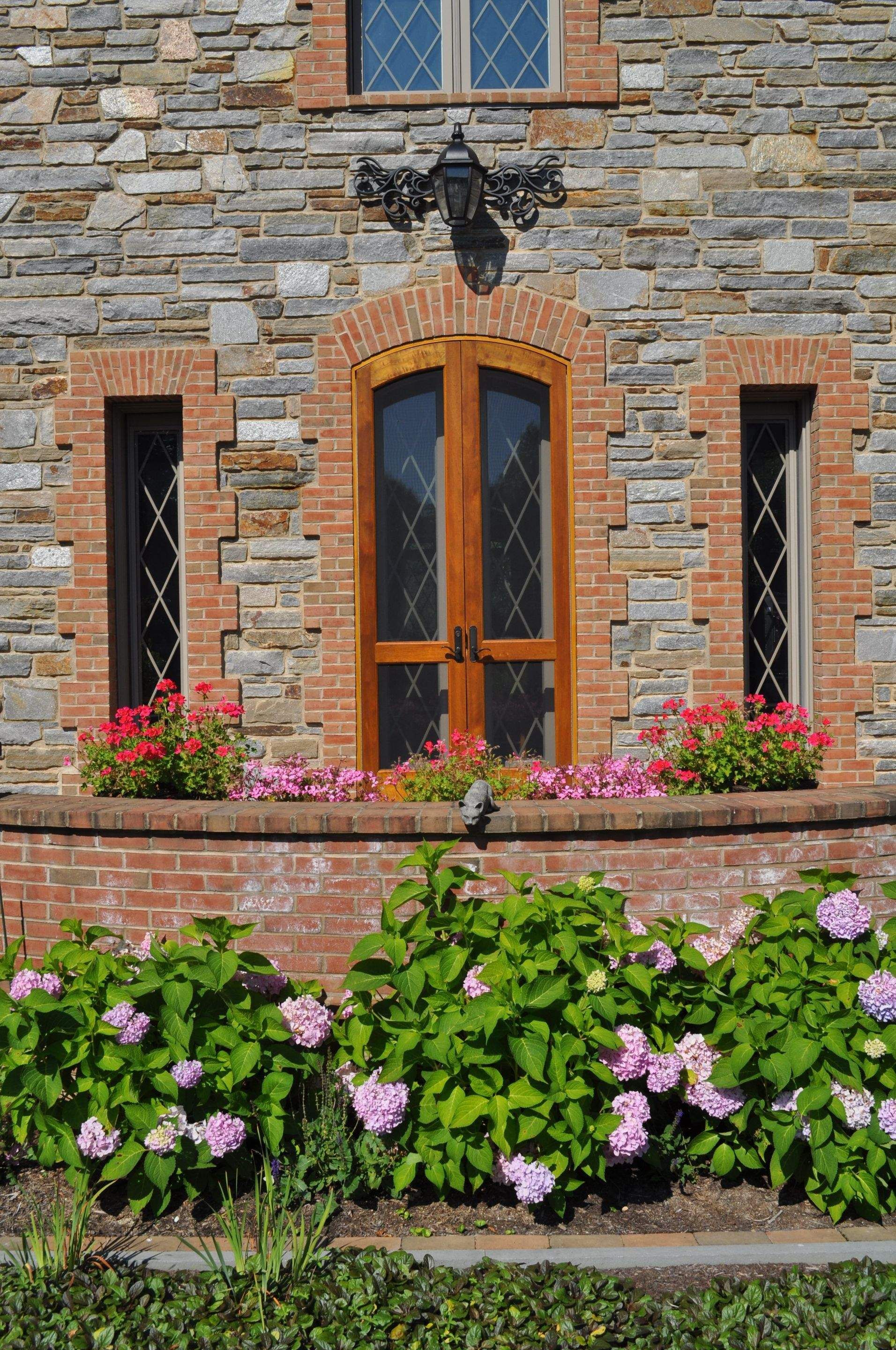 A Brick Building with a Door and Windows — Kennett Square, PA — Classic Lawns
