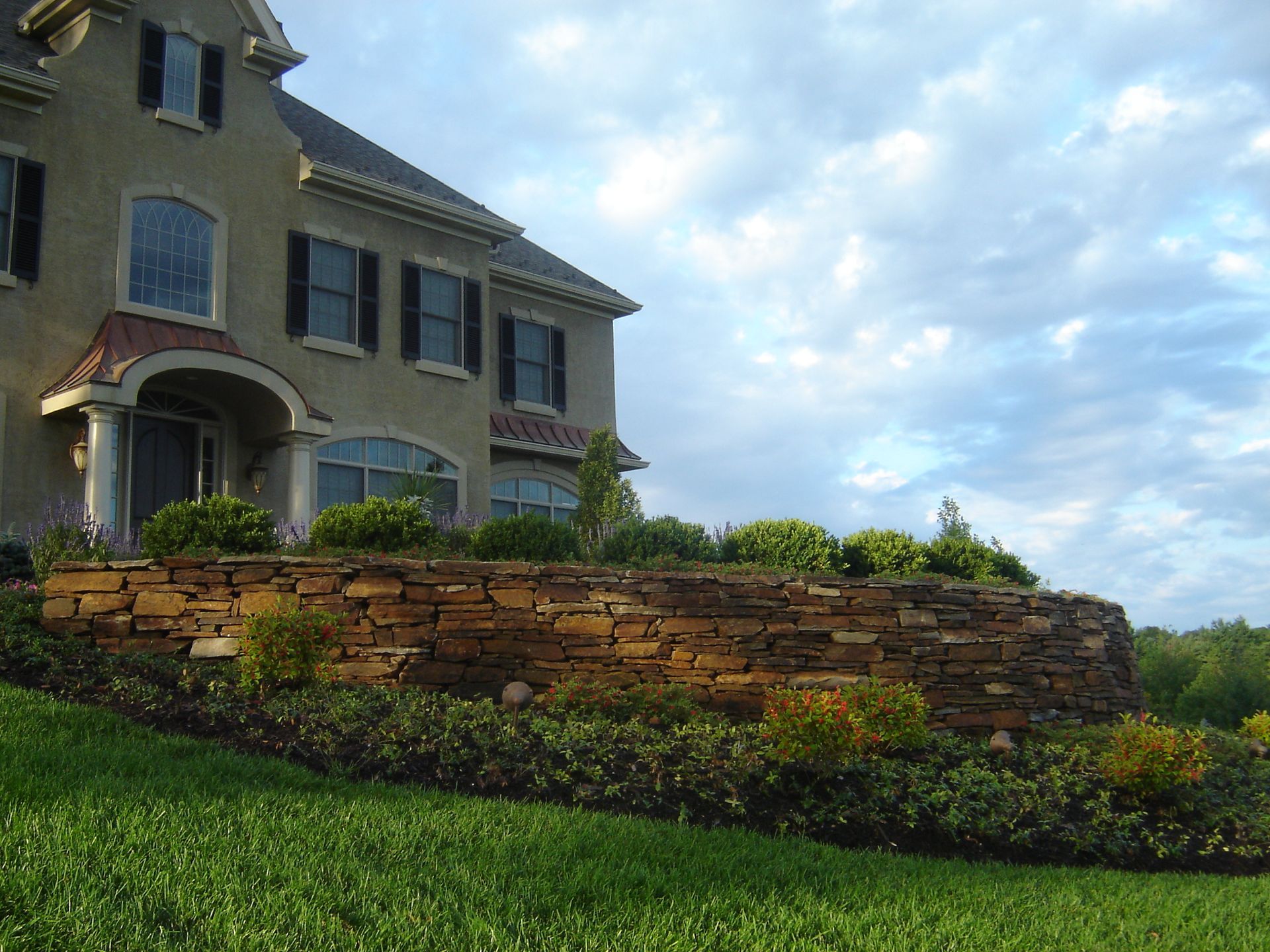 A House with a Stone Wall — Kennett Square, PA — Classic Lawns