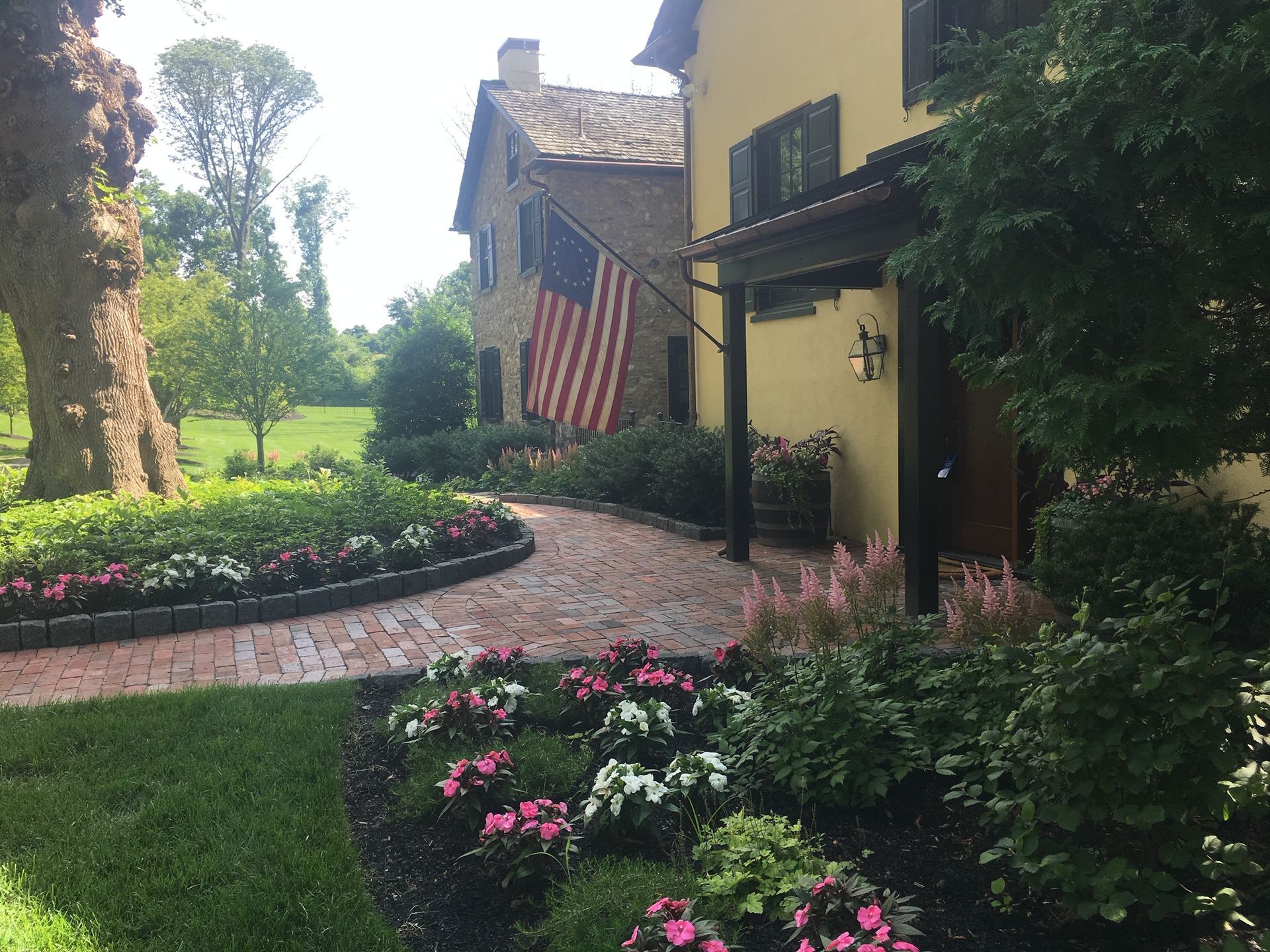 A House with a Flag in the Front — Kennett Square, PA — Classic Lawns
