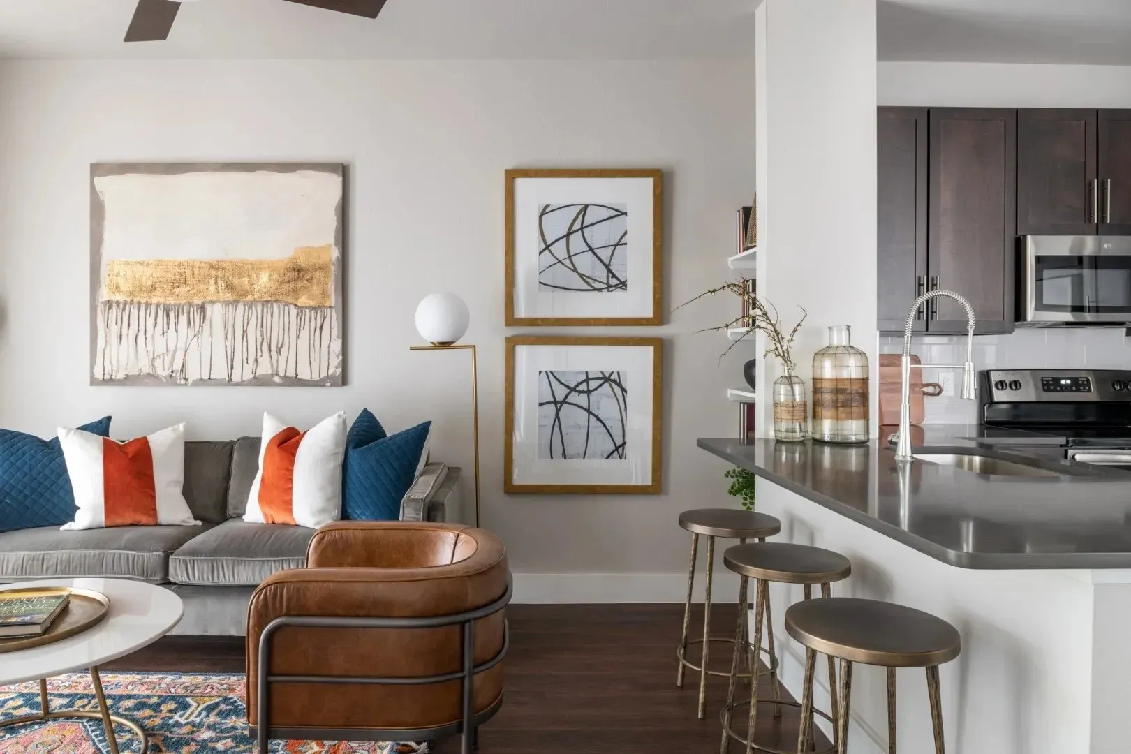 Modern living room with sofa and kitchen view