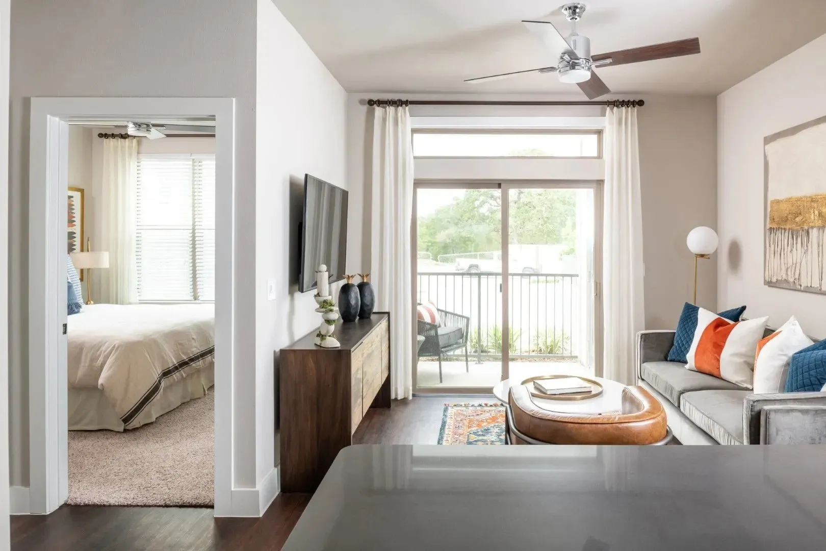 Modern apartment living room and view of bedroom