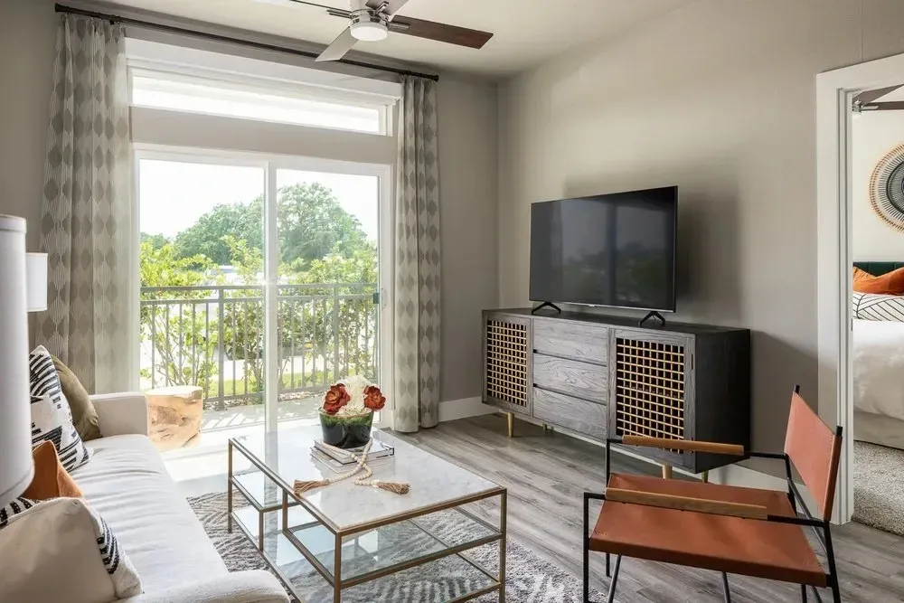 Stylish living room with a sofa, coffee table, and large window