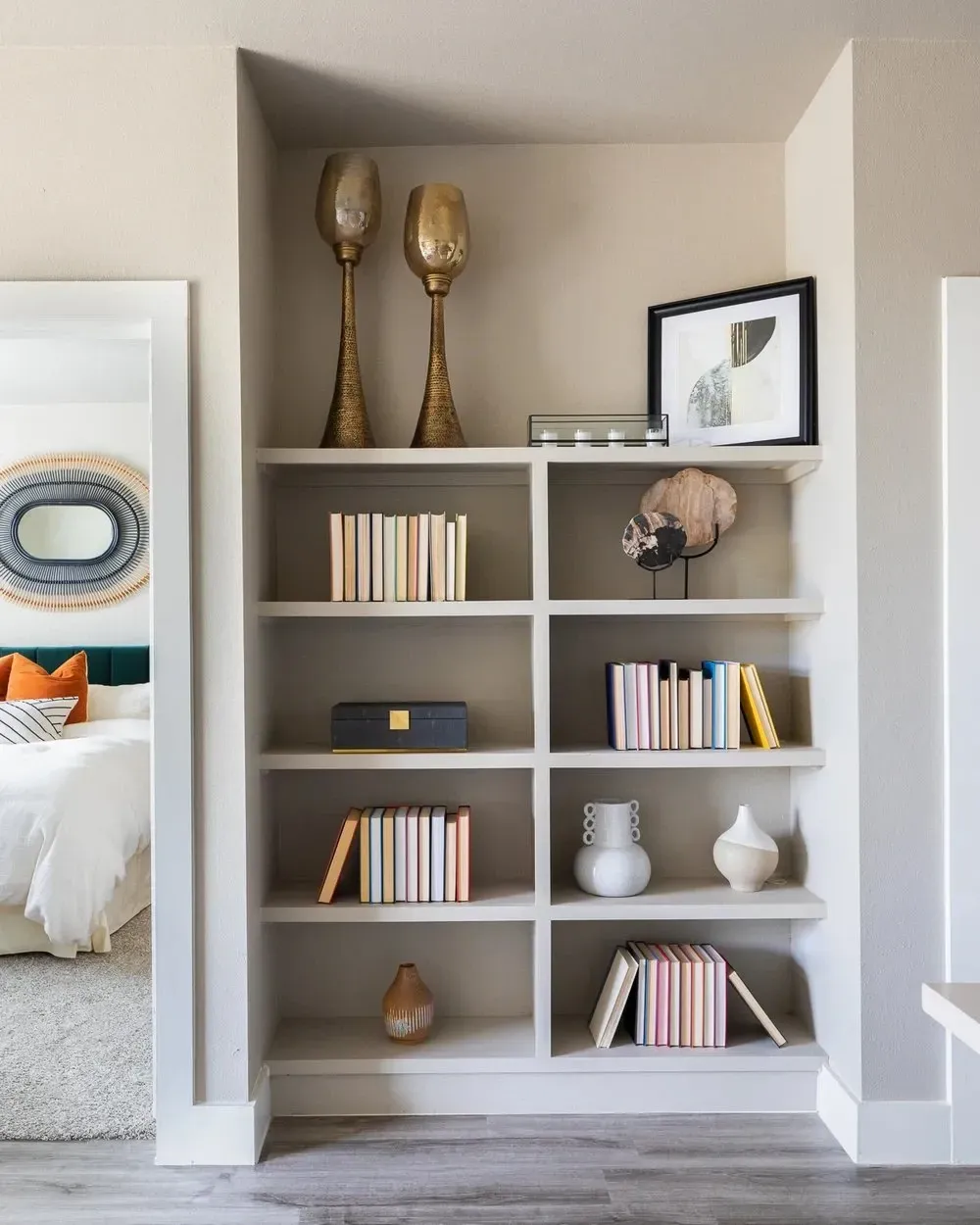 Bookshelf with decorative items in an apartment living space