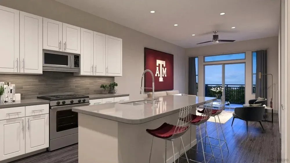 Modern kitchen with white cabinets and stainless steel appliances