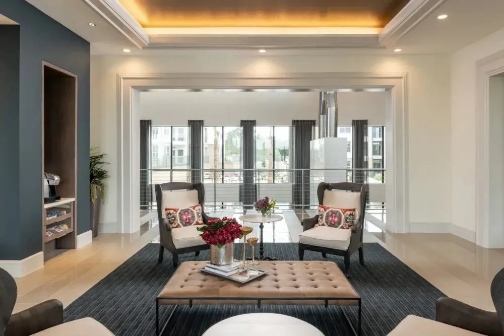 Modern lounge area with seating and decorative table