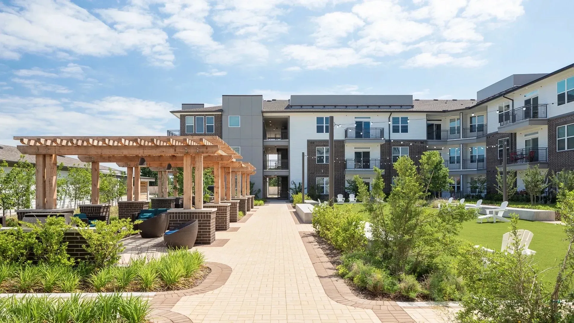 Outdoor community area with pergola and seating