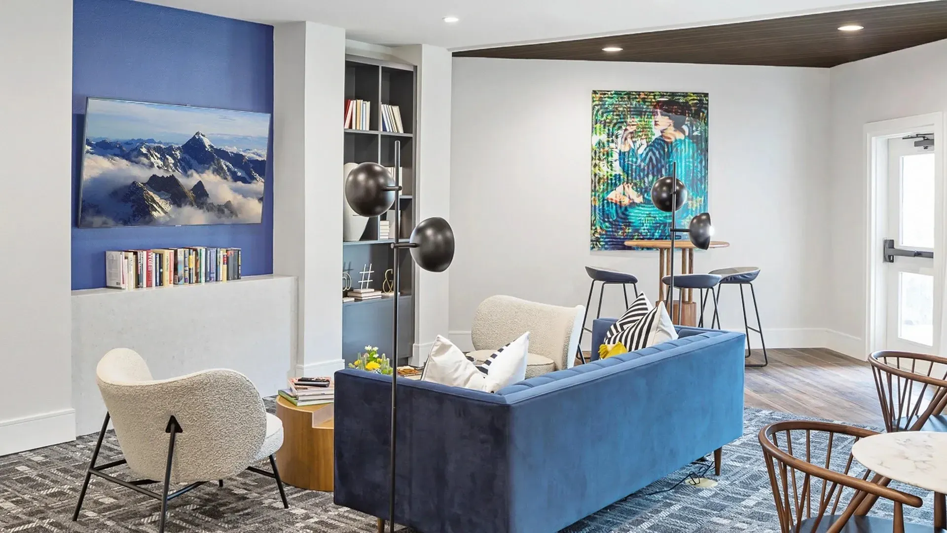 Modern communal lounge area with seating and decor