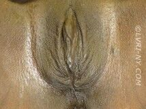 Close-up of human vulva, with visible labia and clitoral hood.