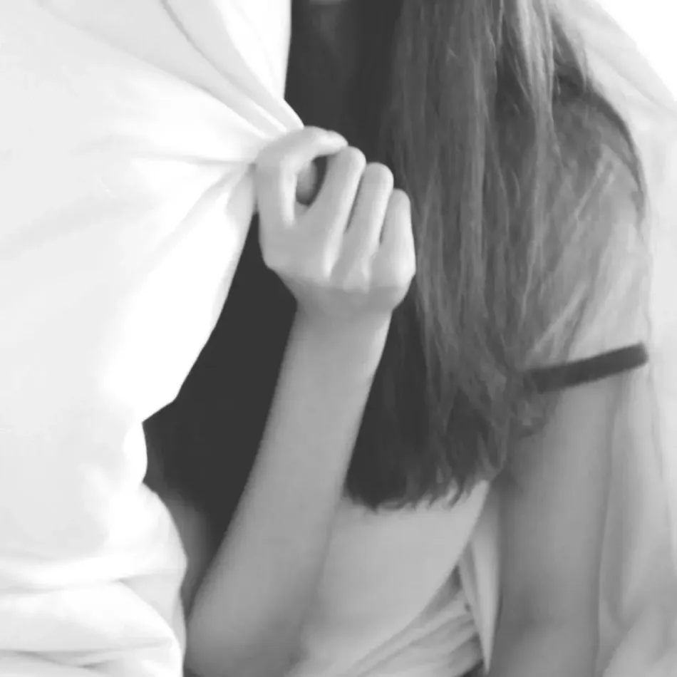 Teen Therapy for Resilience and Confidence Teenage girl partially hiding behind a blanket, reflecting the challenges teen therapy helps adolescents navigate.