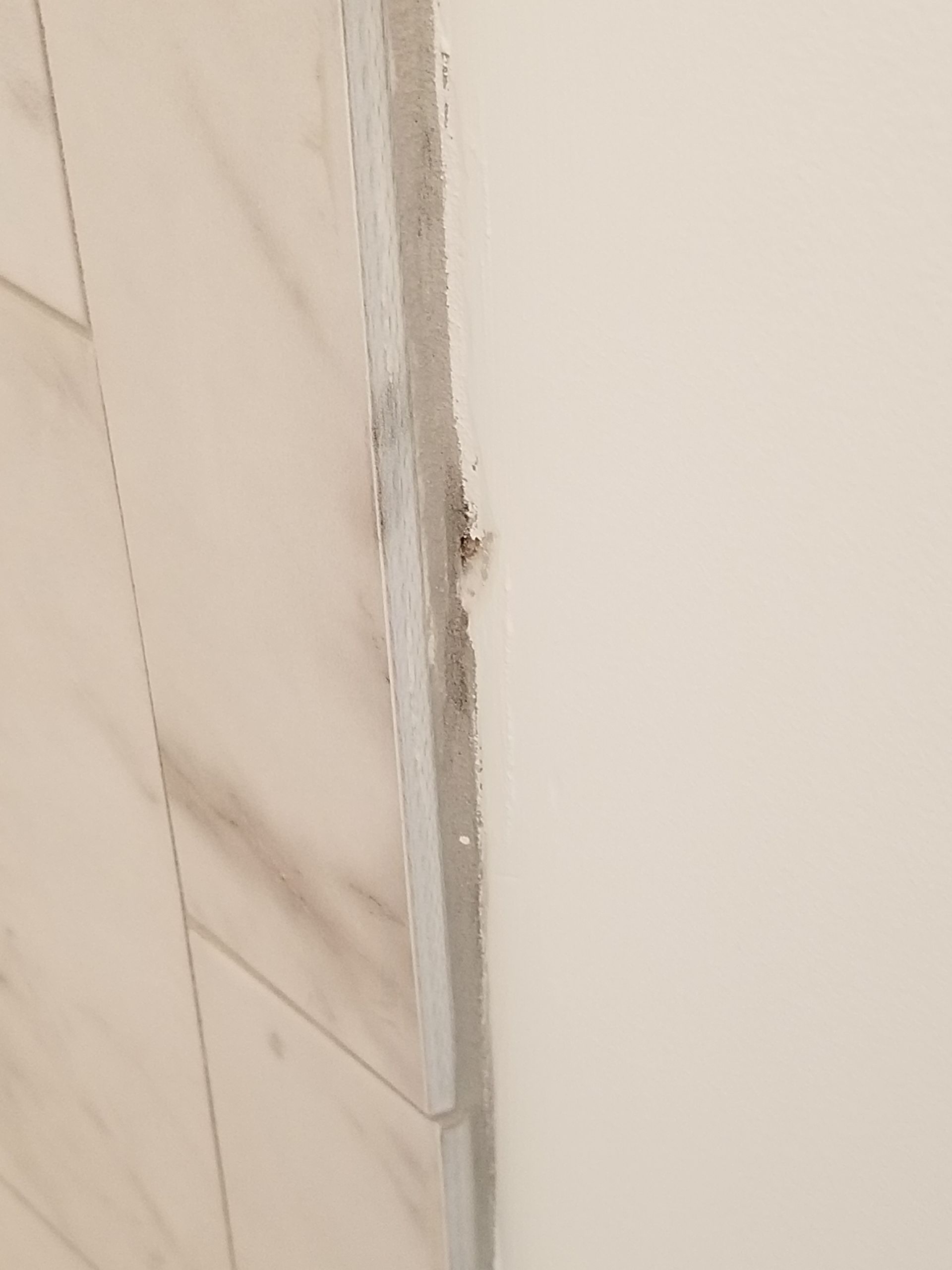 bad tile craftsmanship on shower remodel