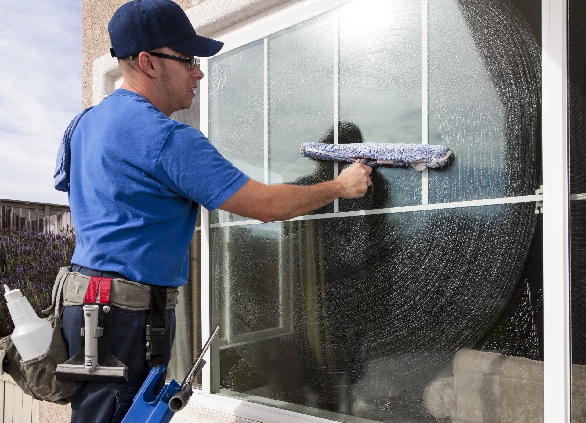 Commercial Cleaning — Man Cleaning the Windows in Fort Myers, FL