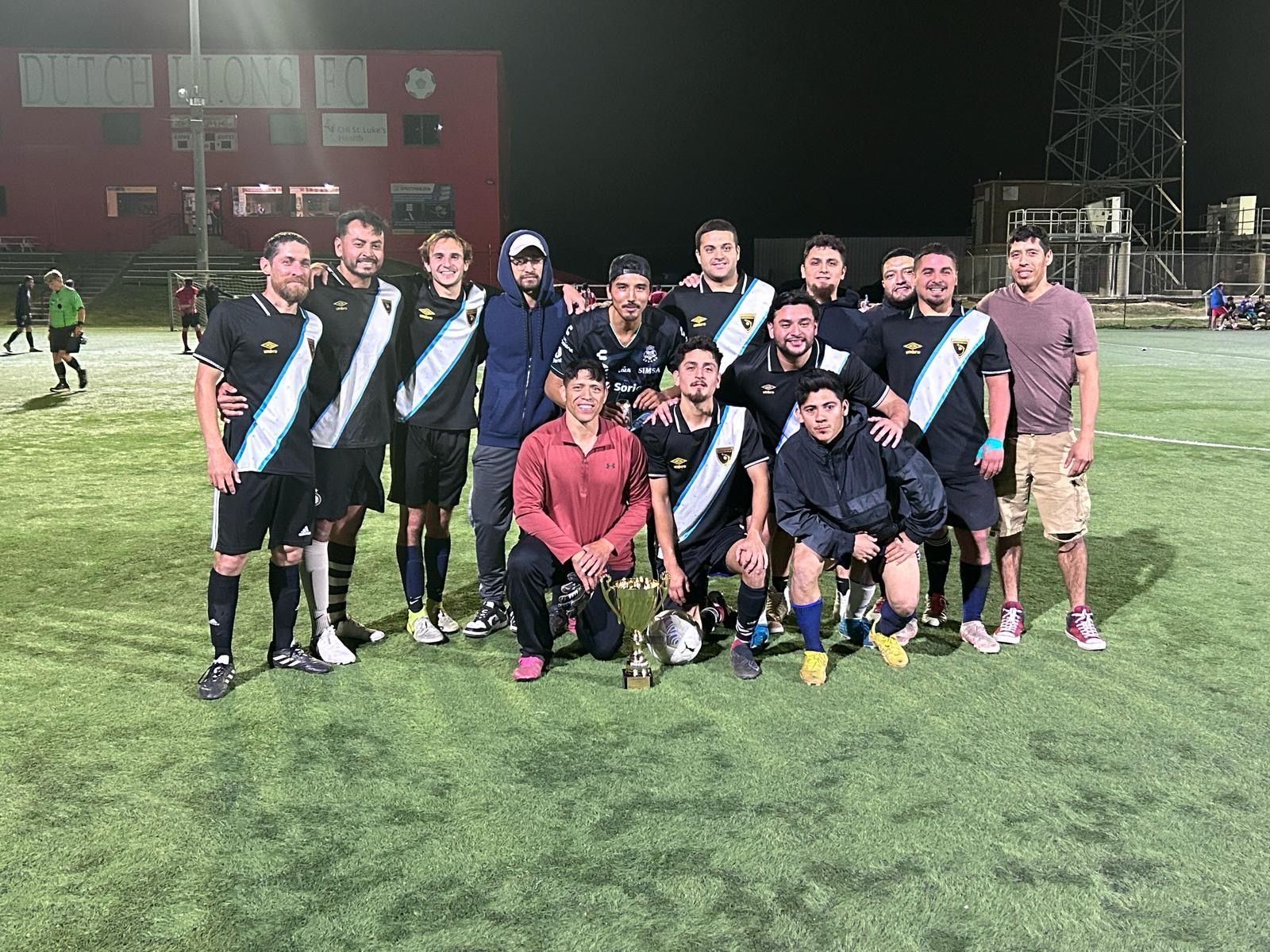 Baseball on a dark surface, with visible stitching.