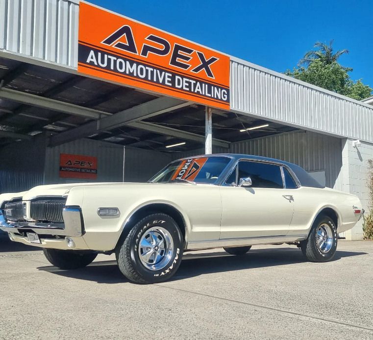 A White Car Is Parked In Front Of An Apex Automotive Detailing — Apex Automotive Detailing In Lismore, NSW