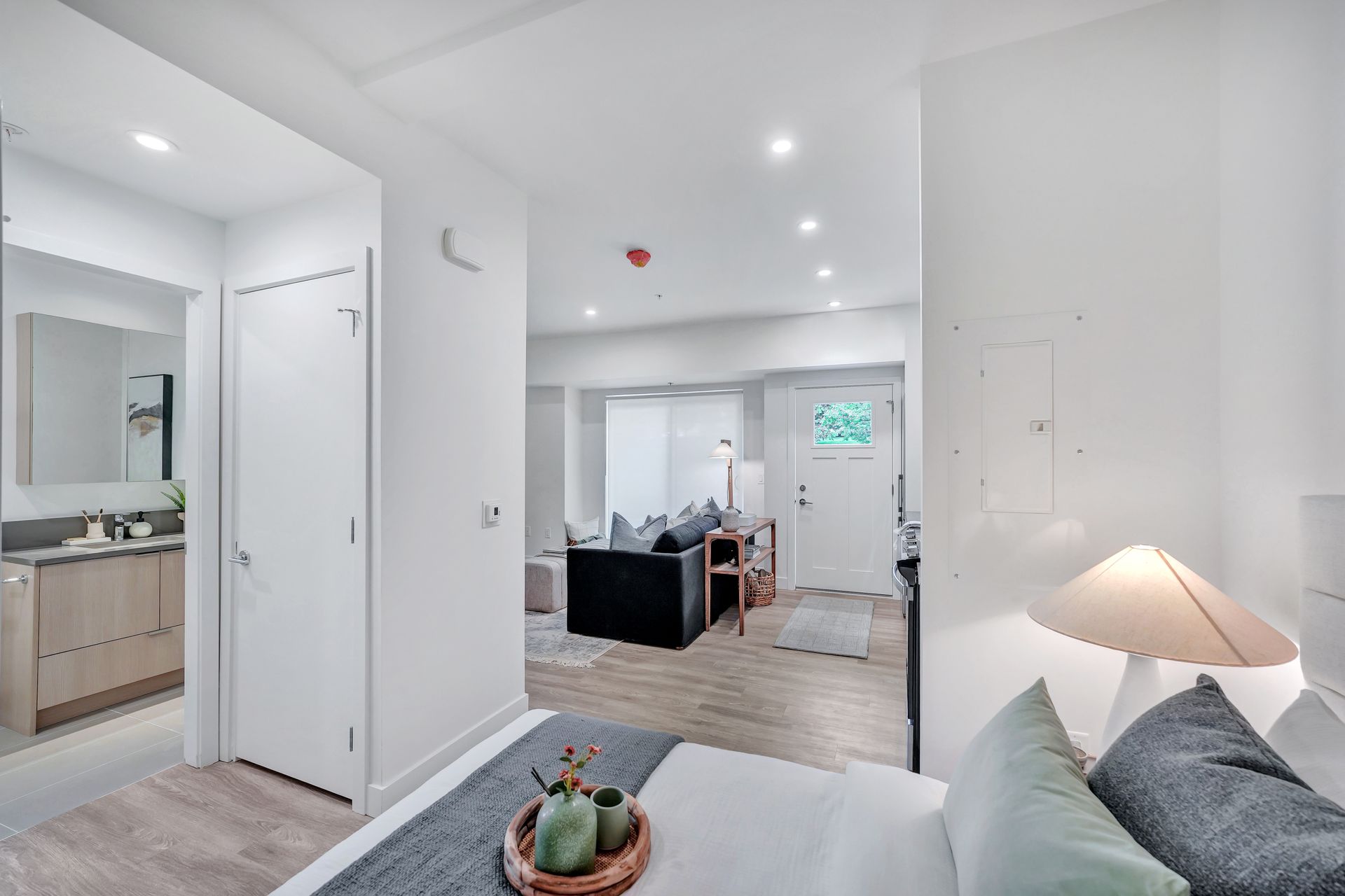 The sun is shining through the windows of a gym.