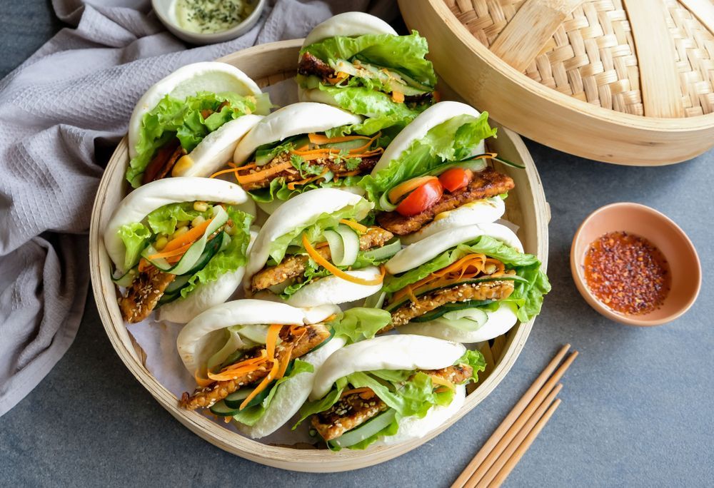 Plate of Fresh Vegetable Bao Buns With Dipping Sauce — Home Nursing Services in Bundanoon, NSW