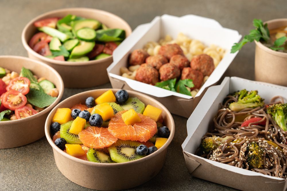 A Variety Of Healthy Food In Bowls And Boxes On A Table — Home Nursing Services In Warners Bay, NSW