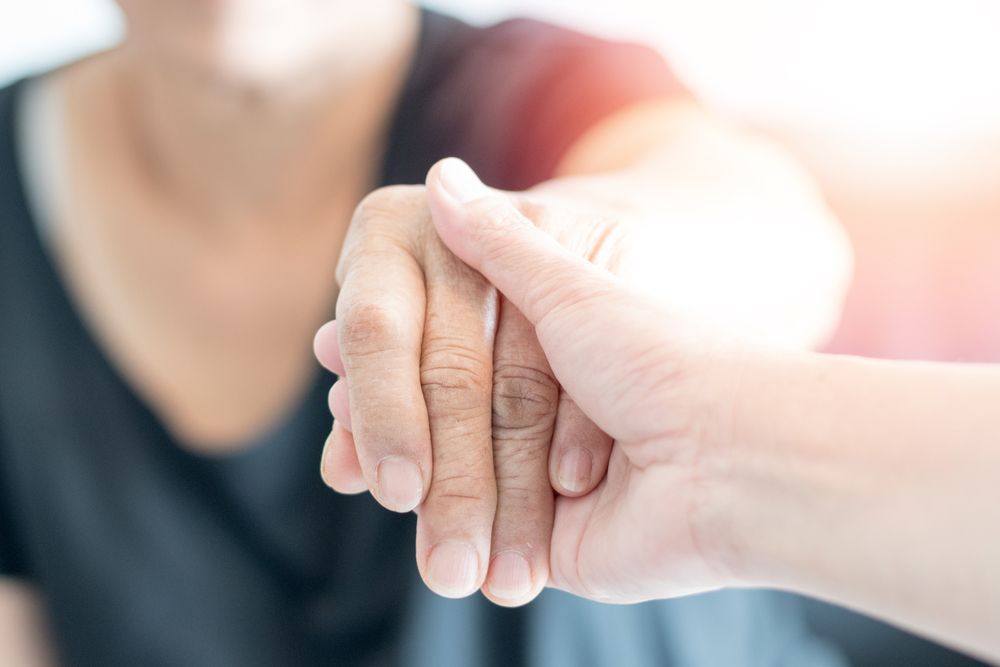 Hands Holding Together in a Soft, Close-up — Home Nursing Services in Bundanoon, NSW