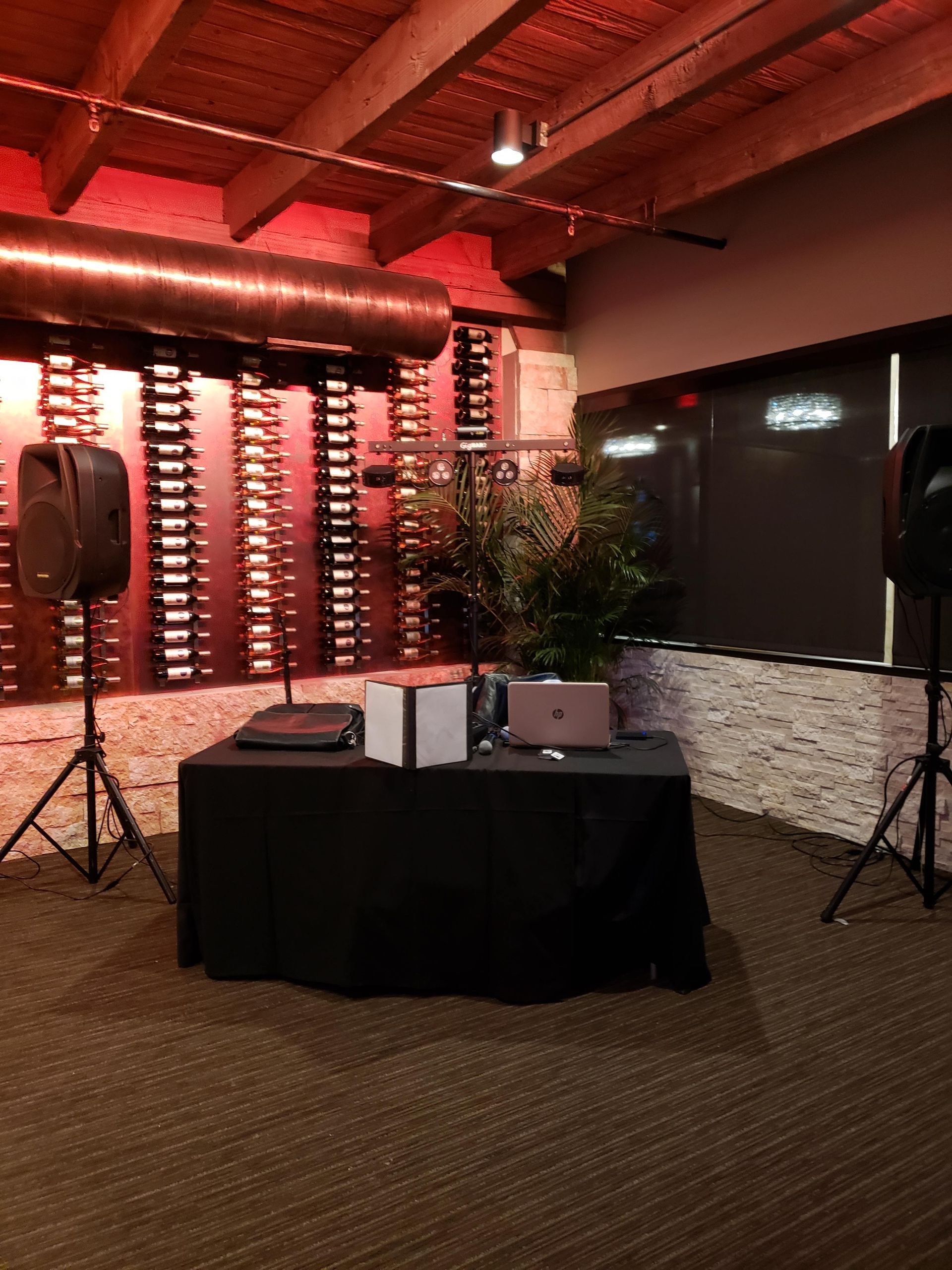 A room with a table and speakers in it