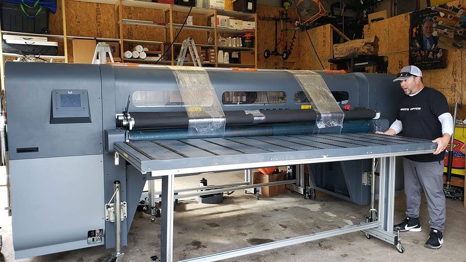Worker examining printed banner