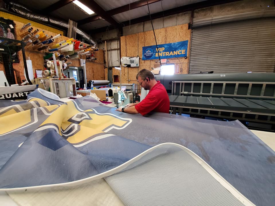 Man adjusting graphic cloth