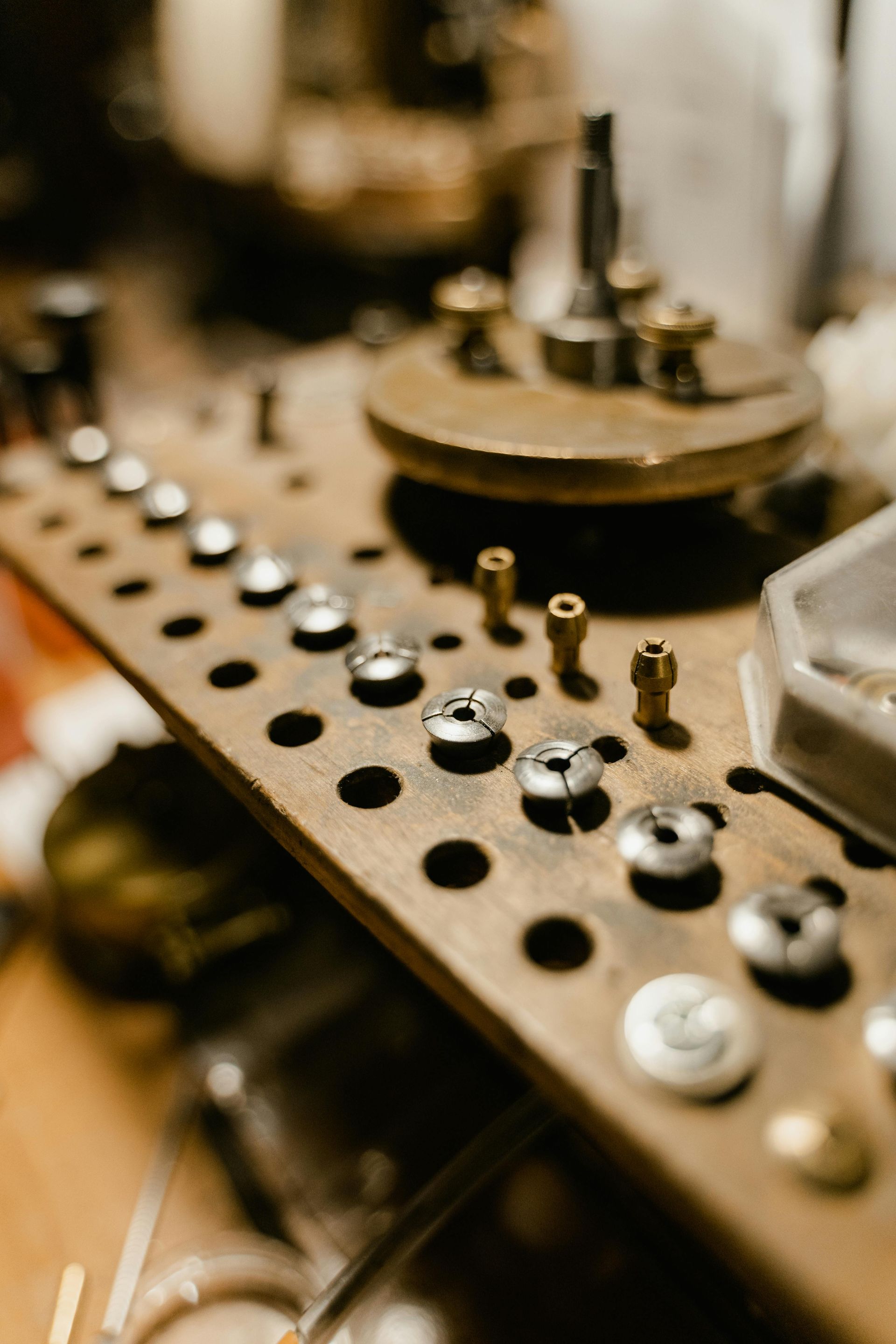 A wooden table with a bunch of buttons on it.