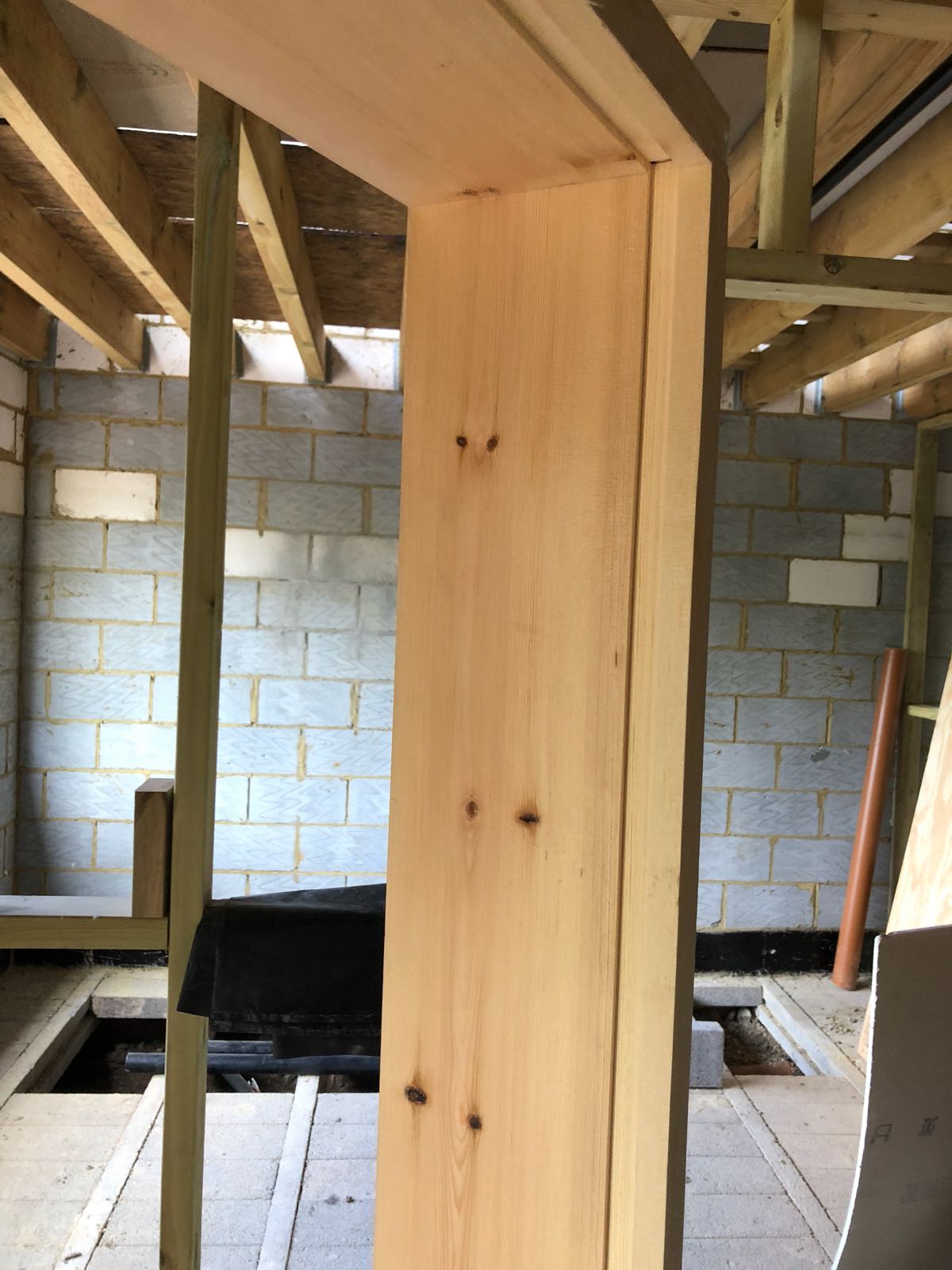 A wooden beam in a building under construction