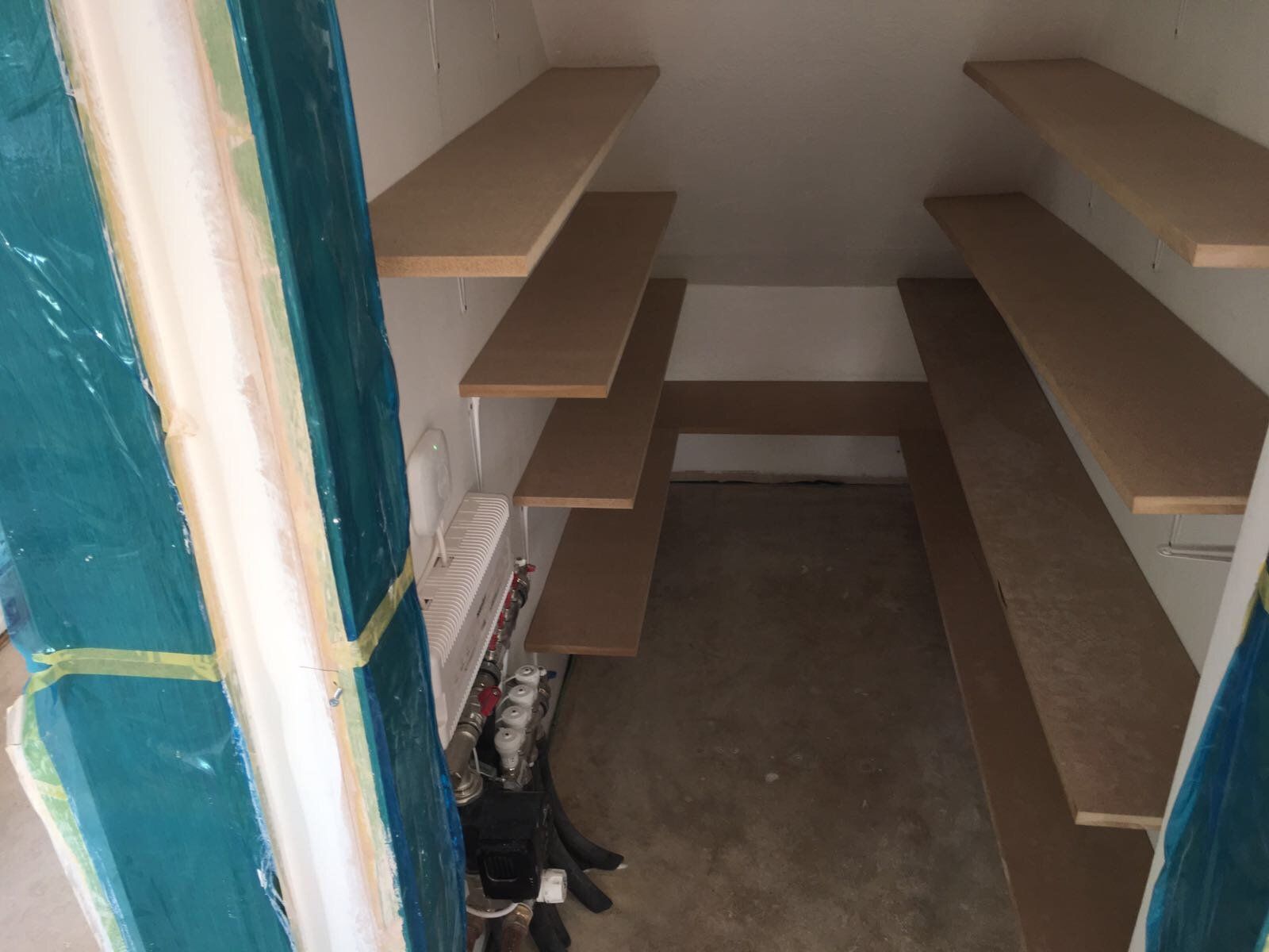 Under stairs cupboard shelves in Burghfield