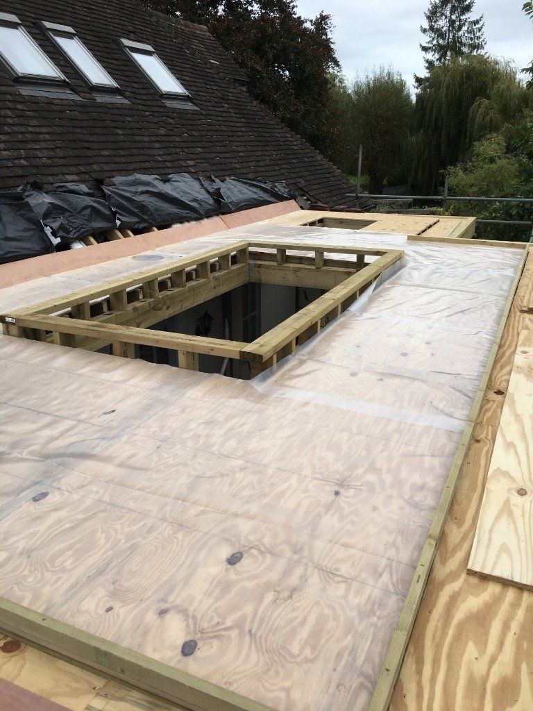 A wooden roof with a hole in the middle of it.