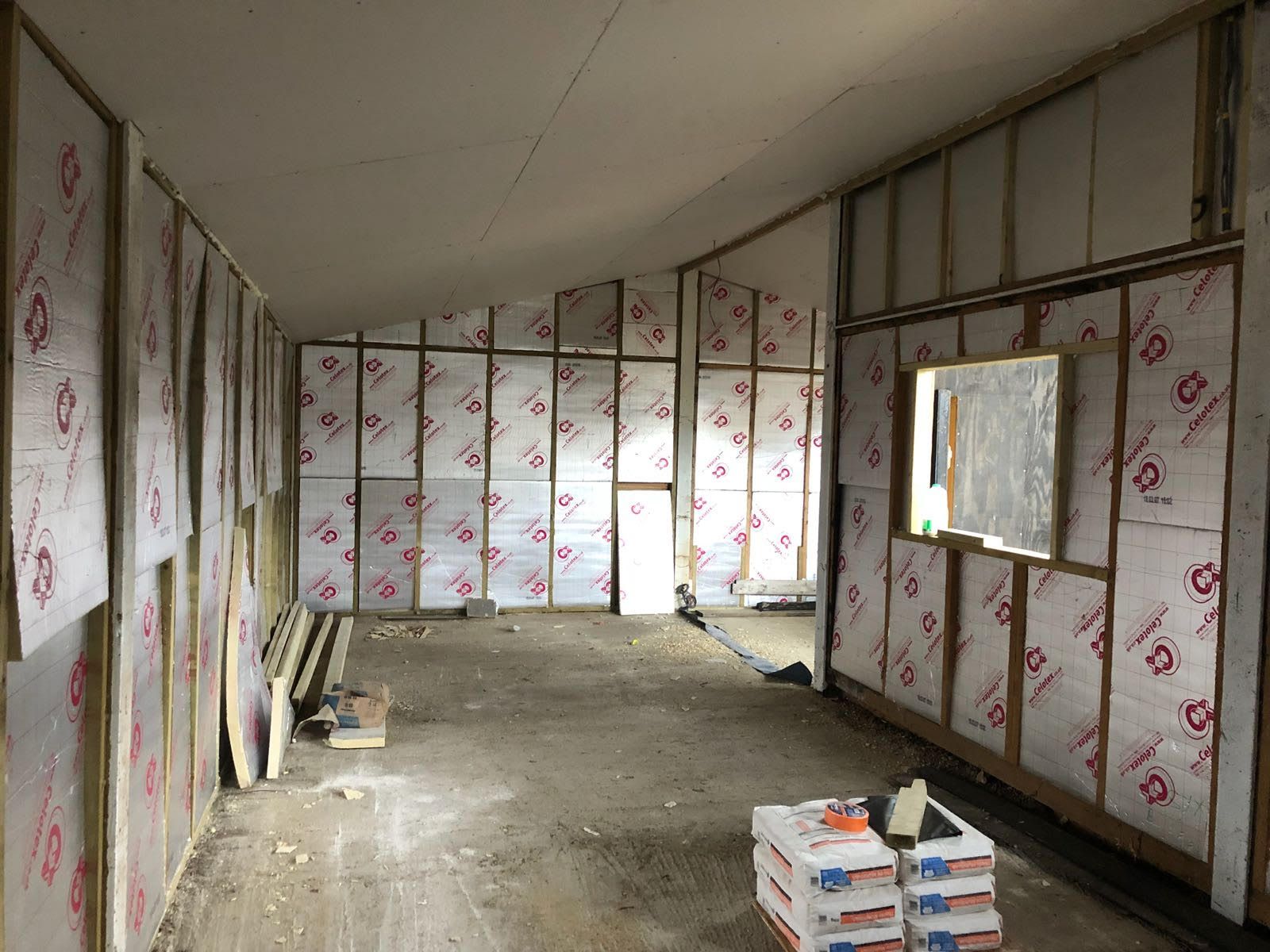 A large room with a lot of insulation on the walls.