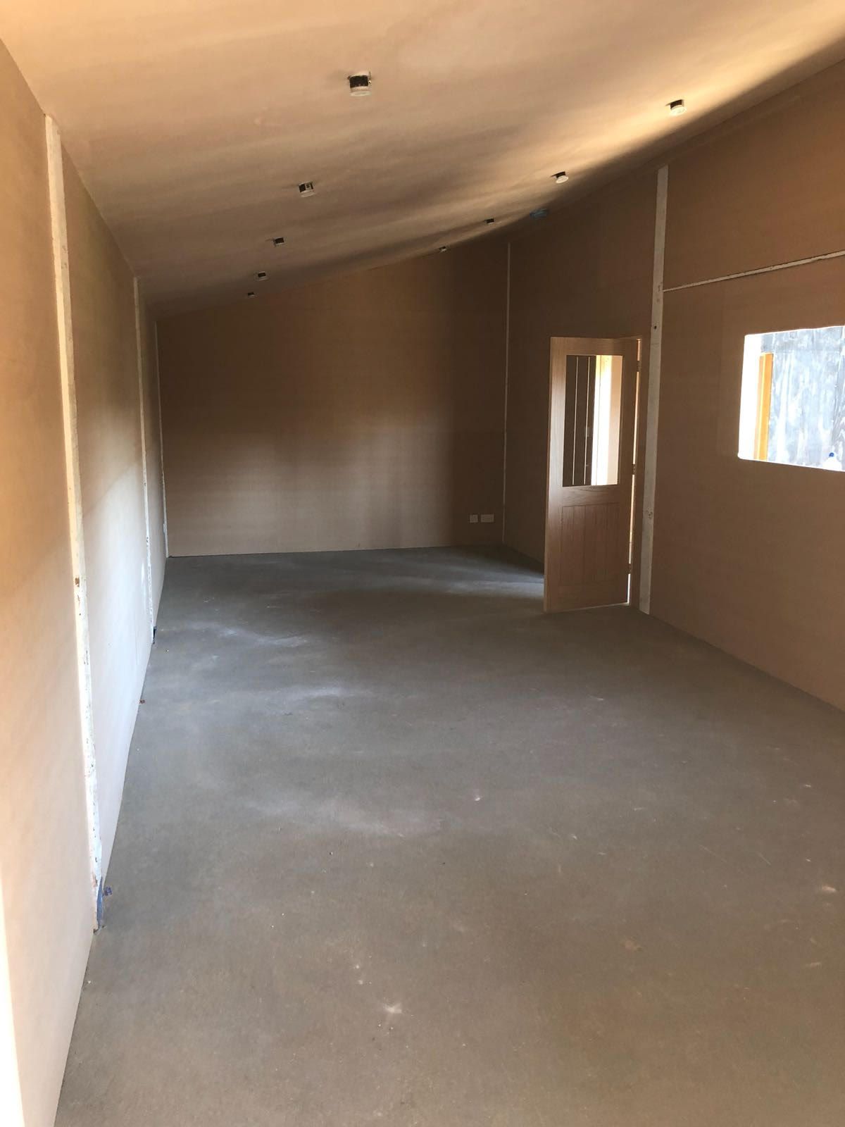 There is a door in the middle of the room.