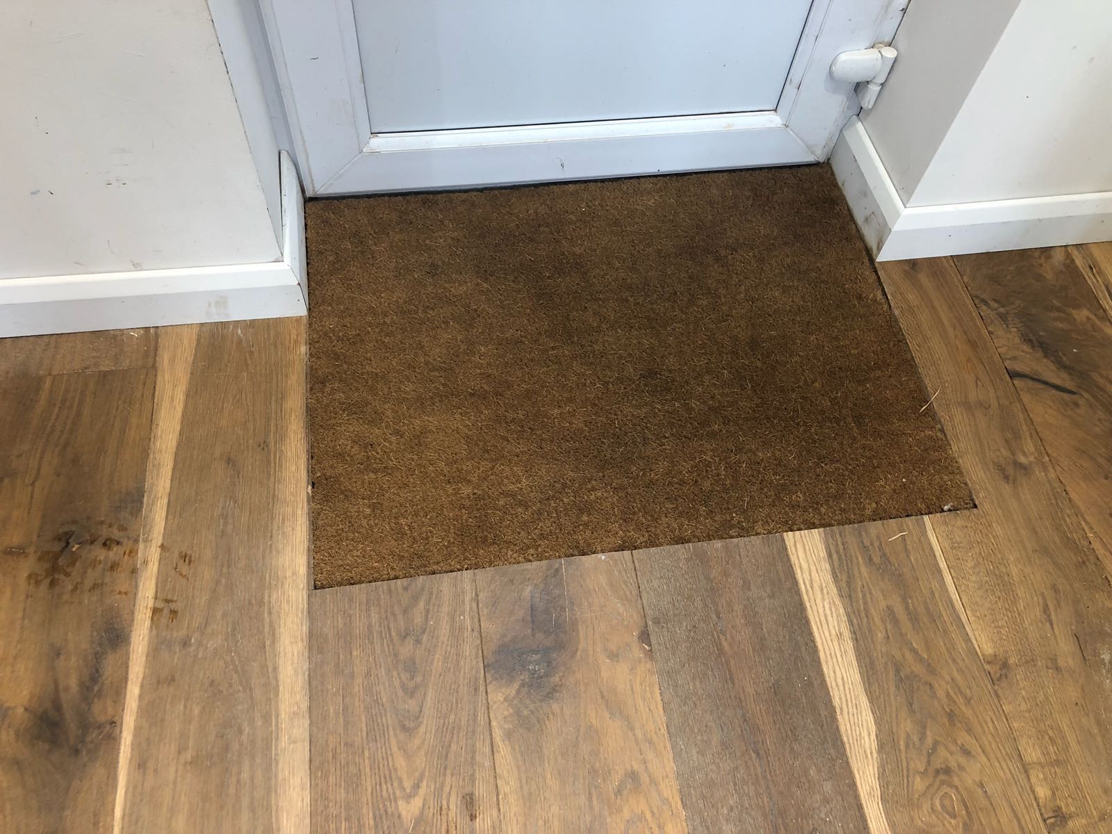 Matt well cut out in wooden floor