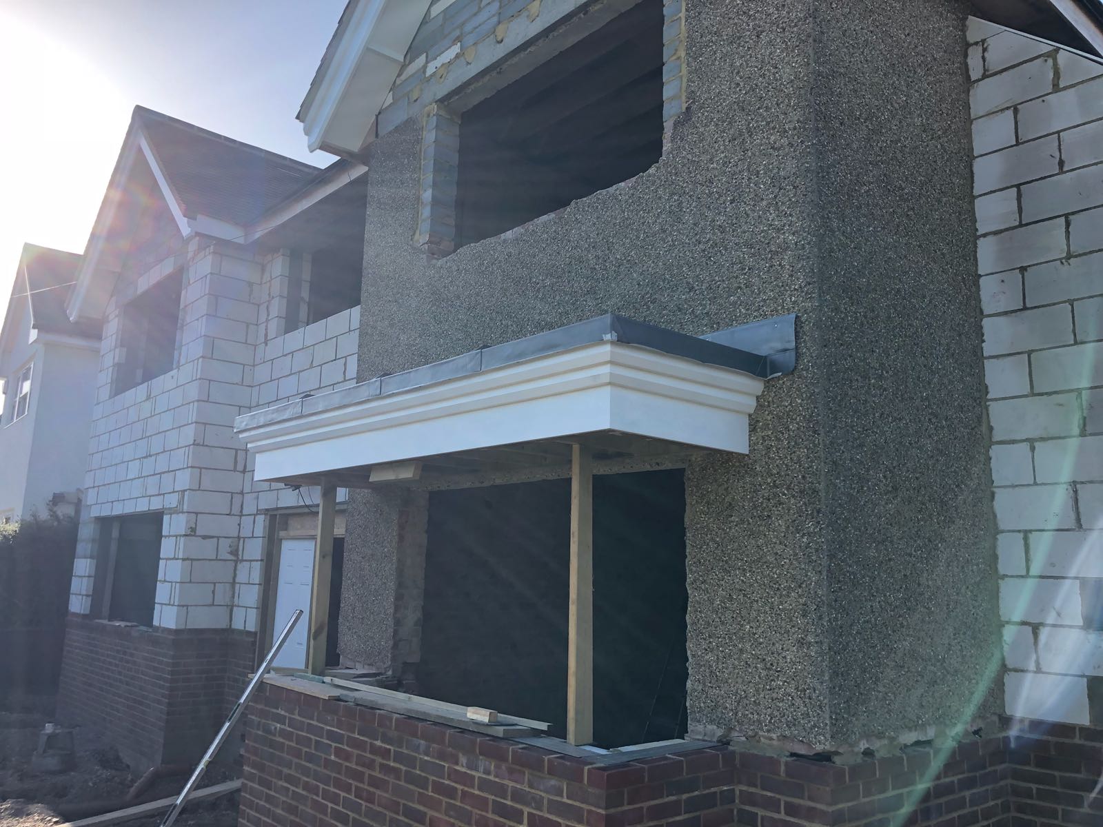 A house is being built with bricks and concrete.