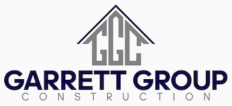 A logo for a construction company called garrett group construction.