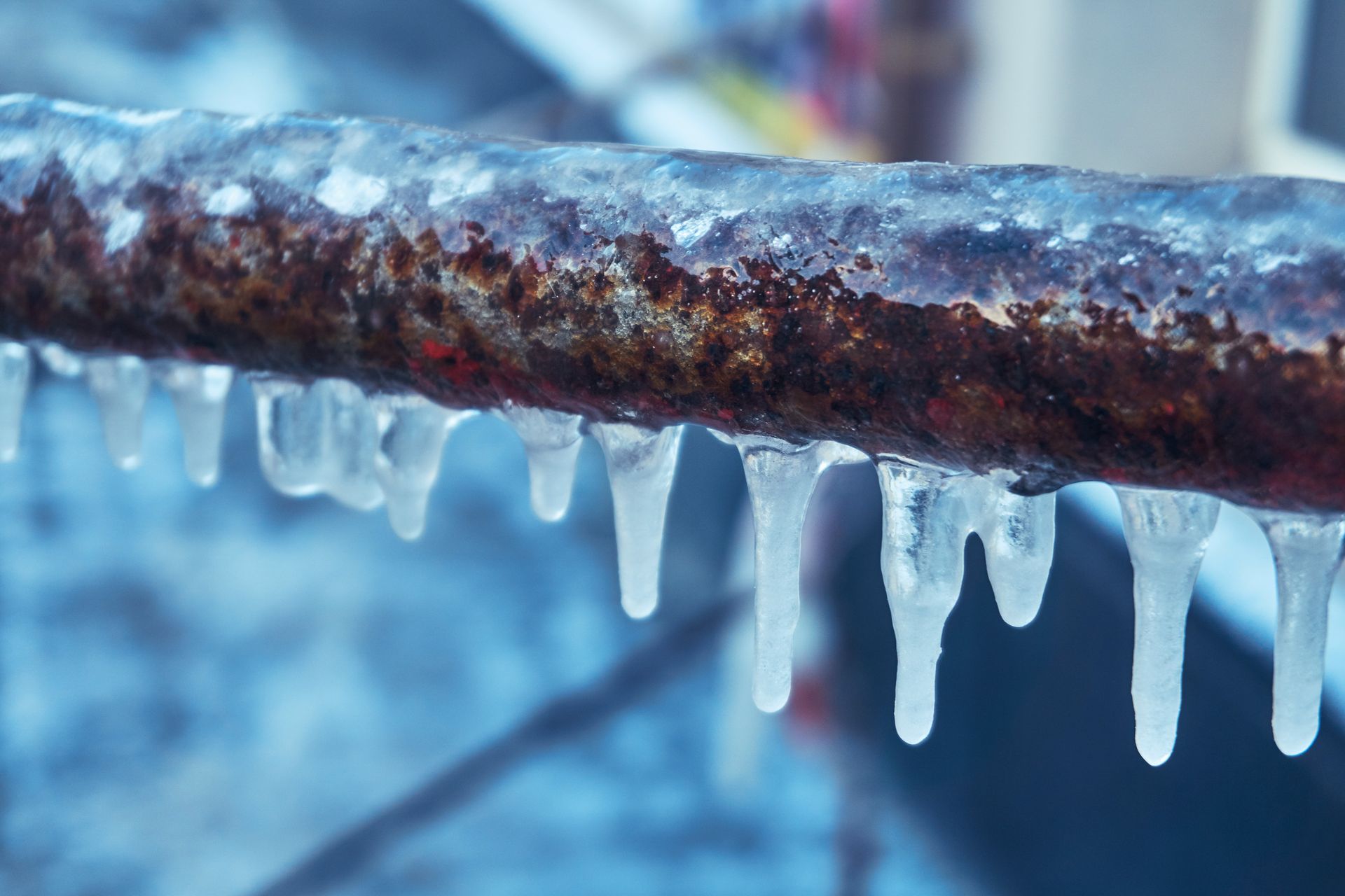 Frozen outdoor pipe with ice buildup