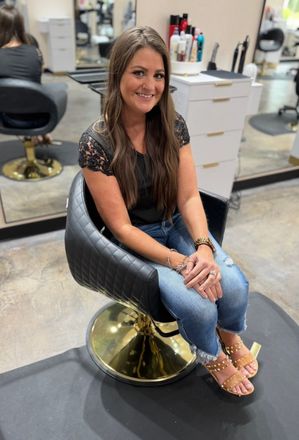 Carolyn, a hair stylist at Revive Hair Salon in Jacksonville, NC.