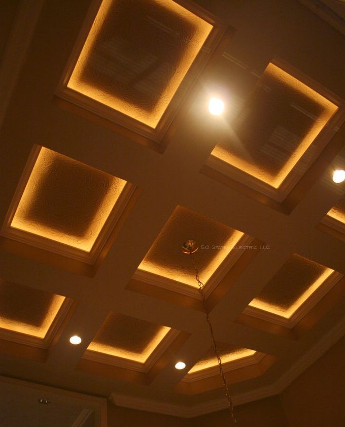 A ceiling with a lot of squares and lights on it