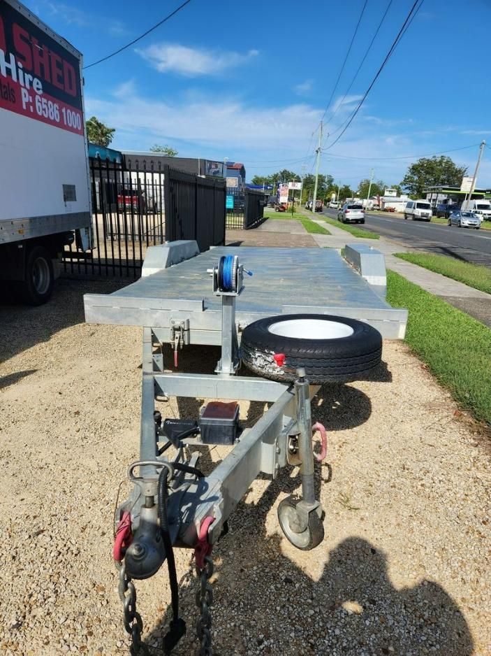 A Trailer Is Parked On The Side Of The Road — Red Shed Hire In Wauchope, NSW