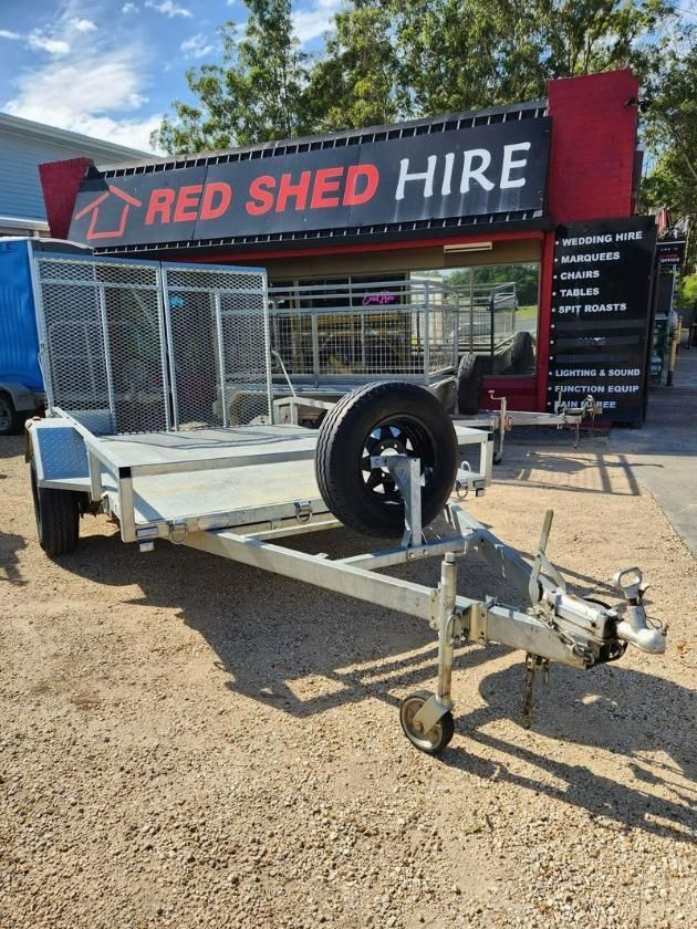 A Trailer Is Parked In Front Of A Red Shed Hire Store — Red Shed Hire In Wauchope, NSW