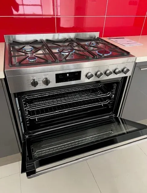 A Stainless Steel Stove With the Door Open in a Kitchen — Coastwide Plumbing Solutions in Sippy Downs, QLD