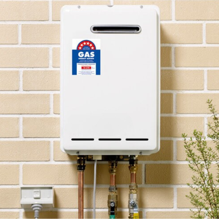 A White Gas Water Heater is Mounted to a Brick Wall — Coastwide Plumbing Solutions in Sippy Downs, QLD